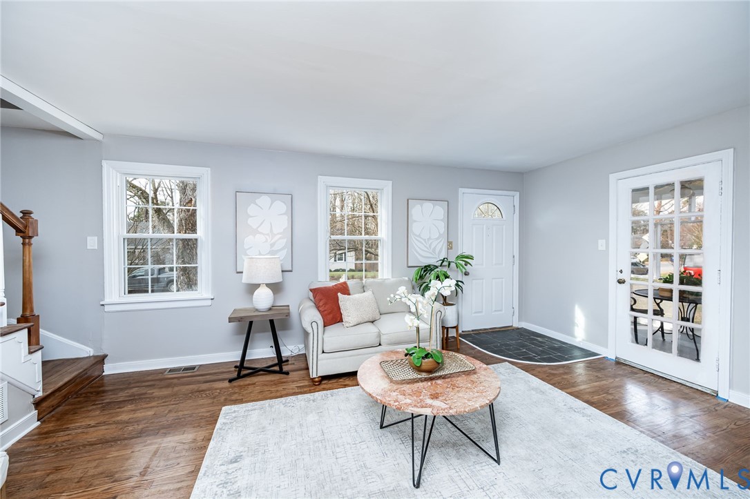 1221 Santa Anna Road Henrico, VA 23229 - Photo 3 of 26 Living room with stairs and refinished hardwood fl