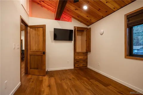a view of front door with wooden floor