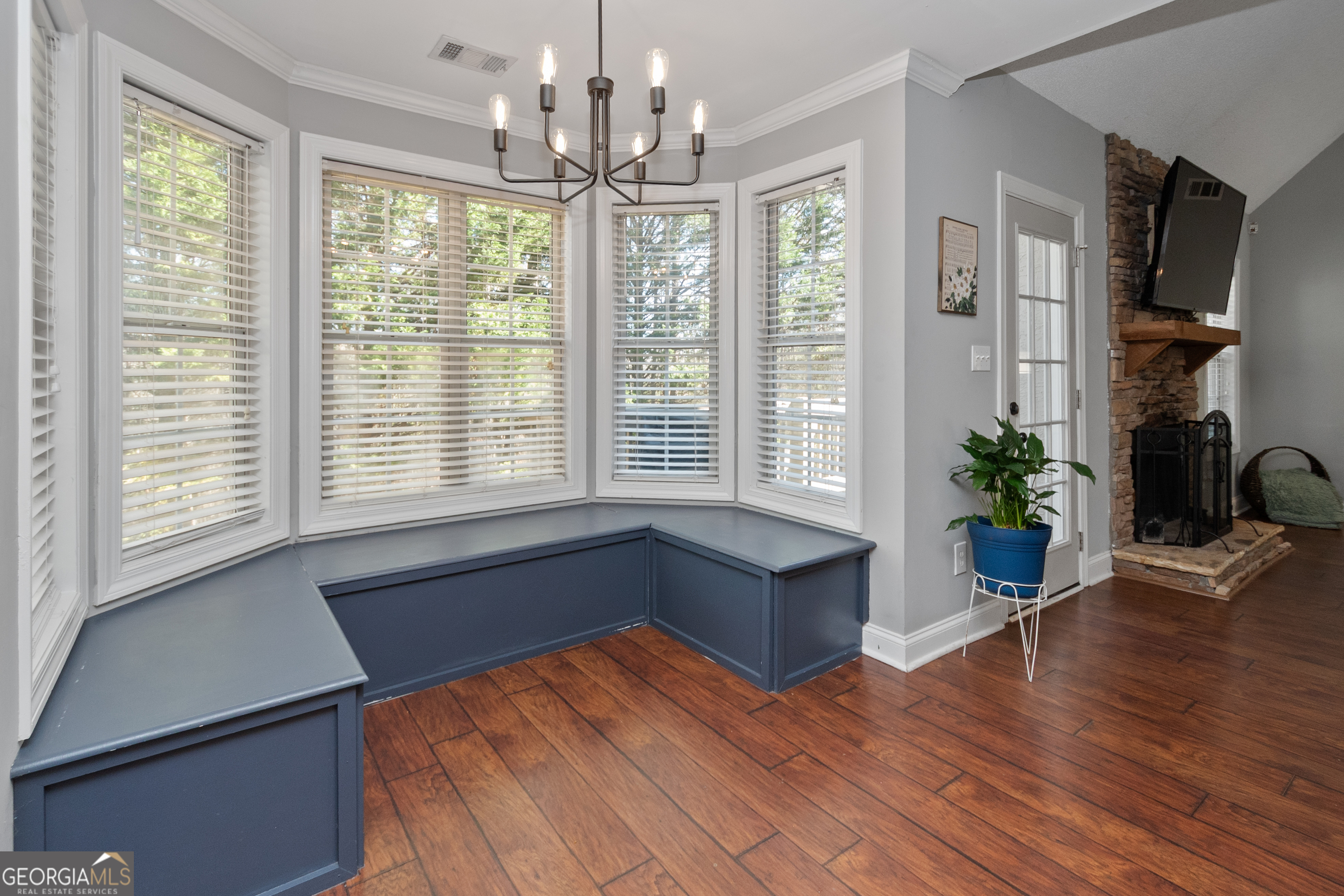 568 Martin Mill Road Moreland, GA 30259 - Photo 14 of 70 a spacious bedroom with wooden floor and a large window