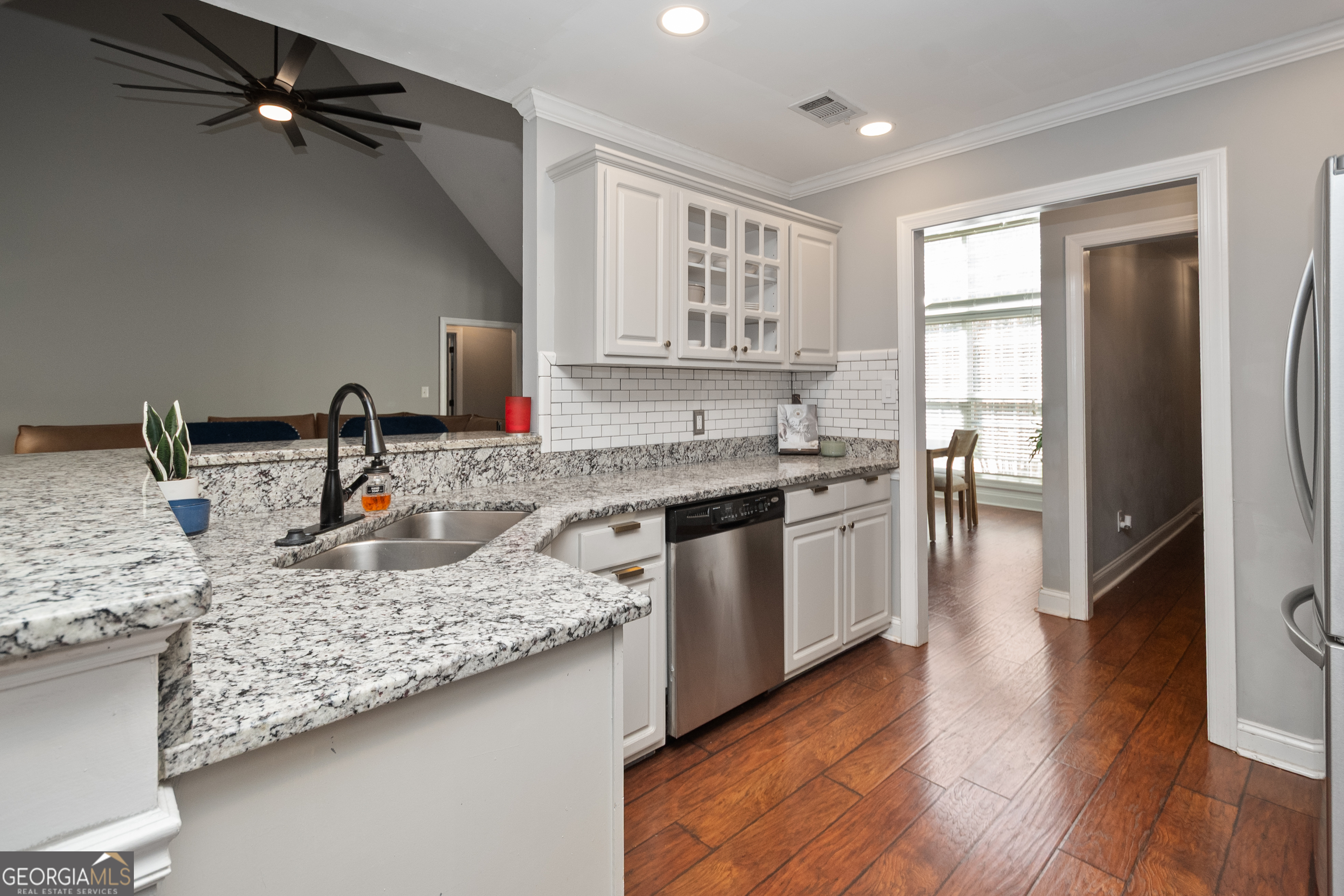 568 Martin Mill Road Moreland, GA 30259 - Photo 18 of 70 a kitchen with stainless steel appliances granite countertop a sink stove and refrigerator