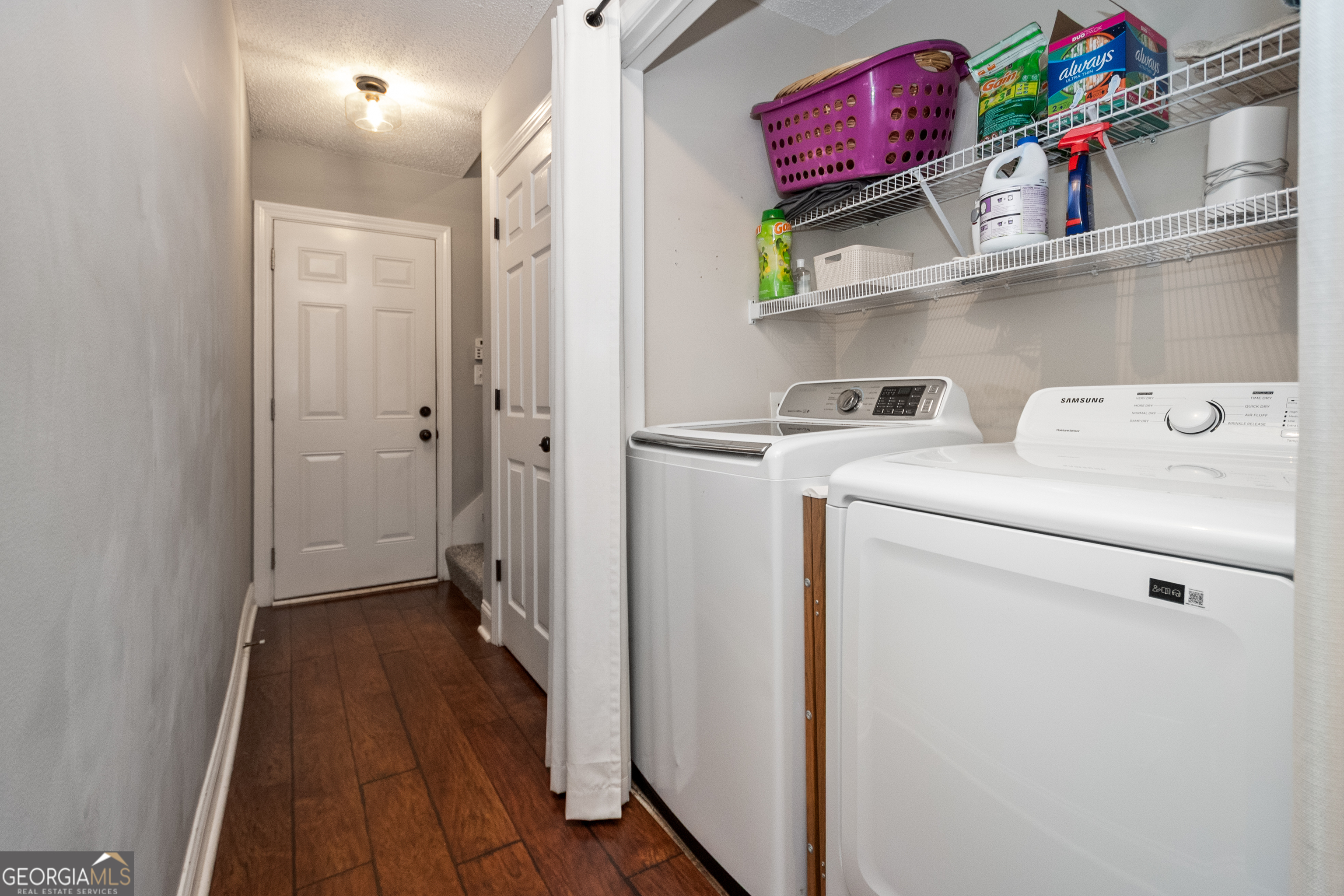 568 Martin Mill Road Moreland, GA 30259 - Photo 19 of 70 a view of hallway with washer and dryer