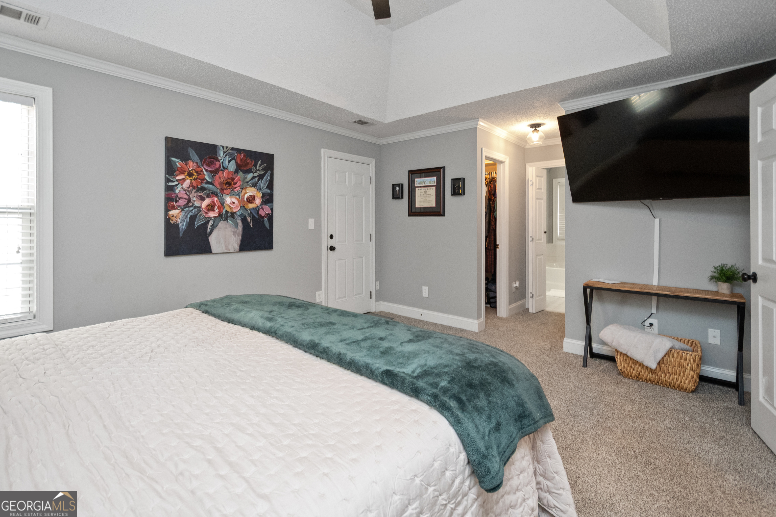 568 Martin Mill Road Moreland, GA 30259 - Photo 21 of 70 a bedroom with a bed and a flat screen tv