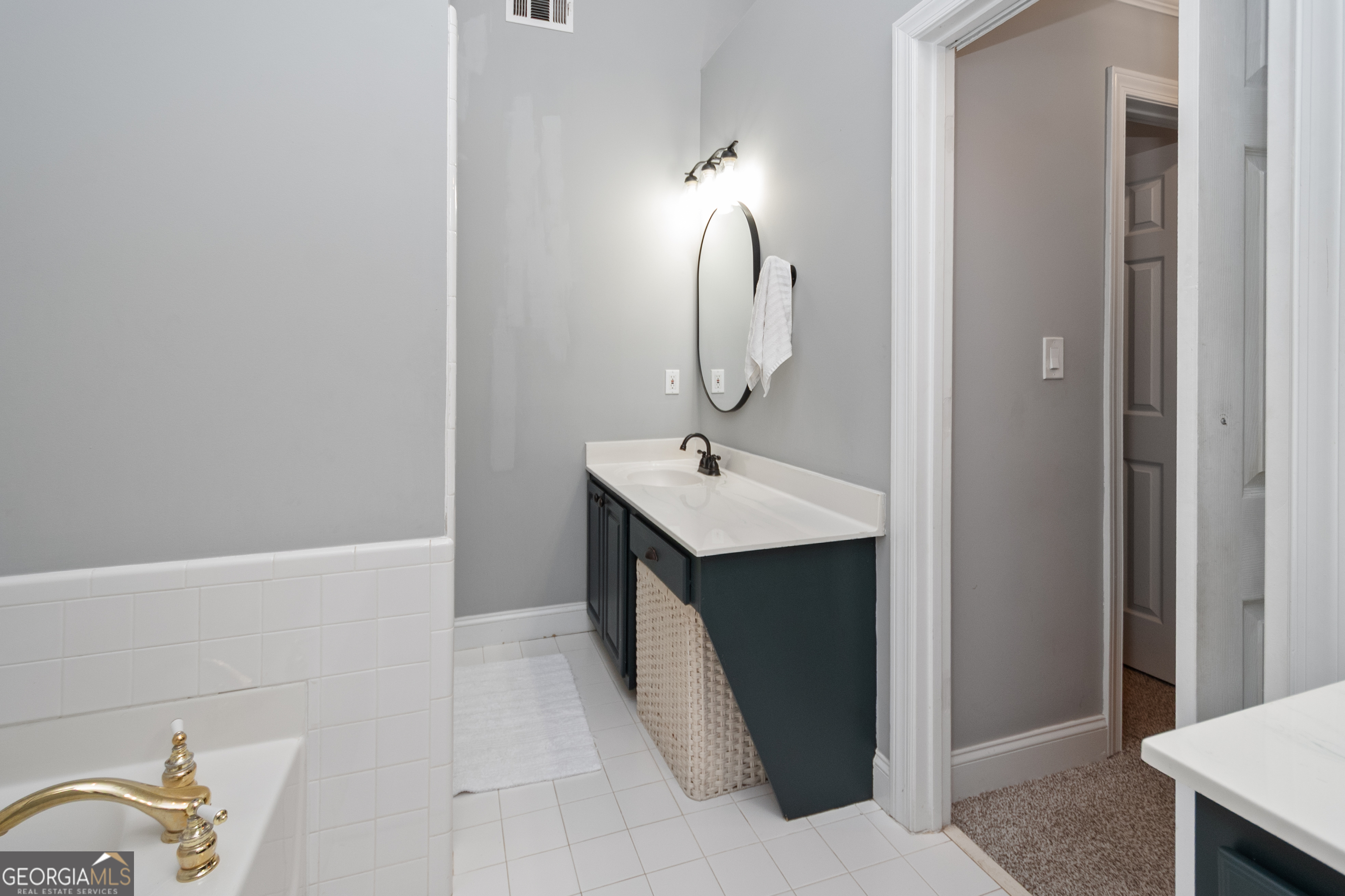 568 Martin Mill Road Moreland, GA 30259 - Photo 26 of 70 a bathroom with a sink and a mirror