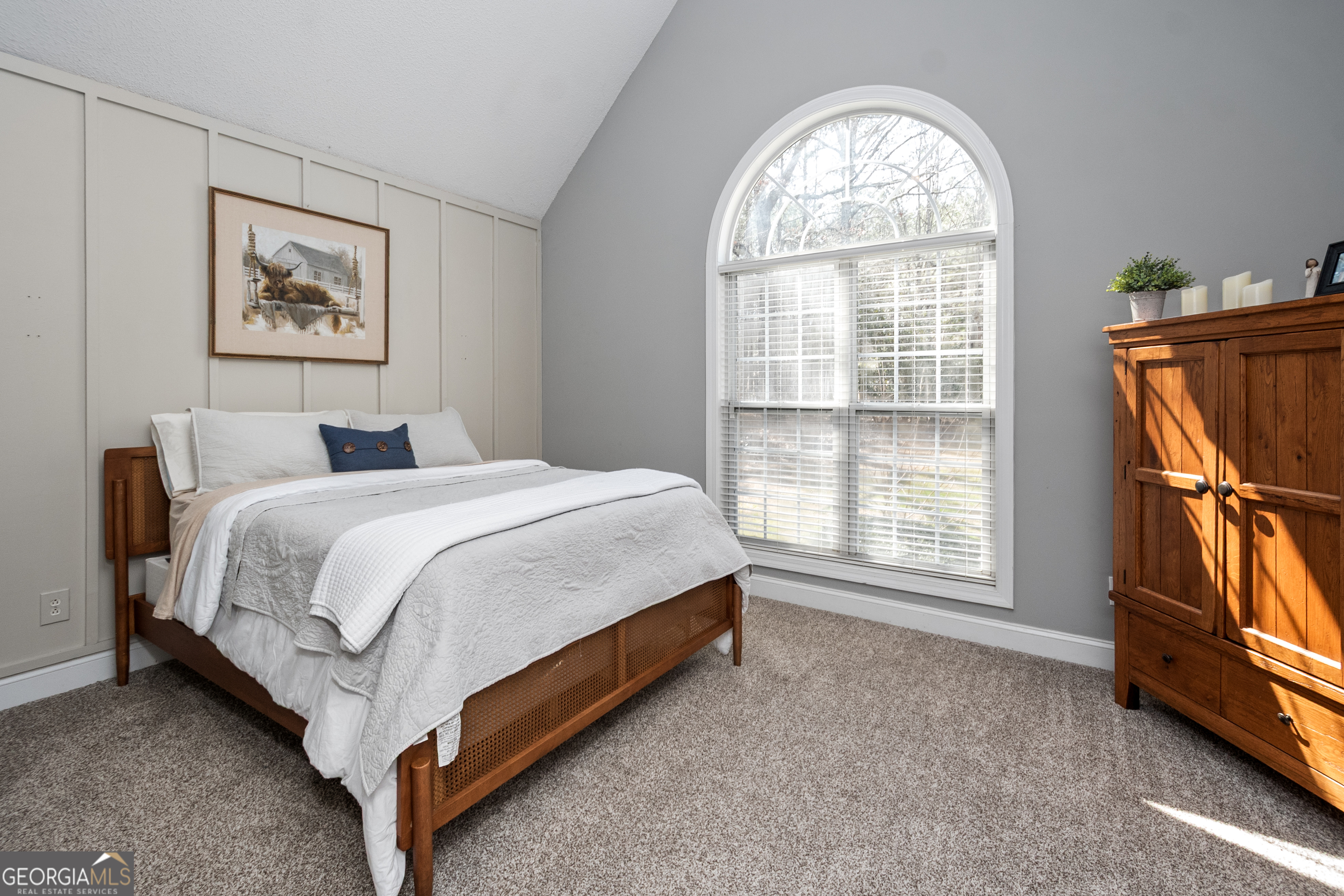 568 Martin Mill Road Moreland, GA 30259 - Photo 28 of 70 a bed sitting in a bedroom next to a window