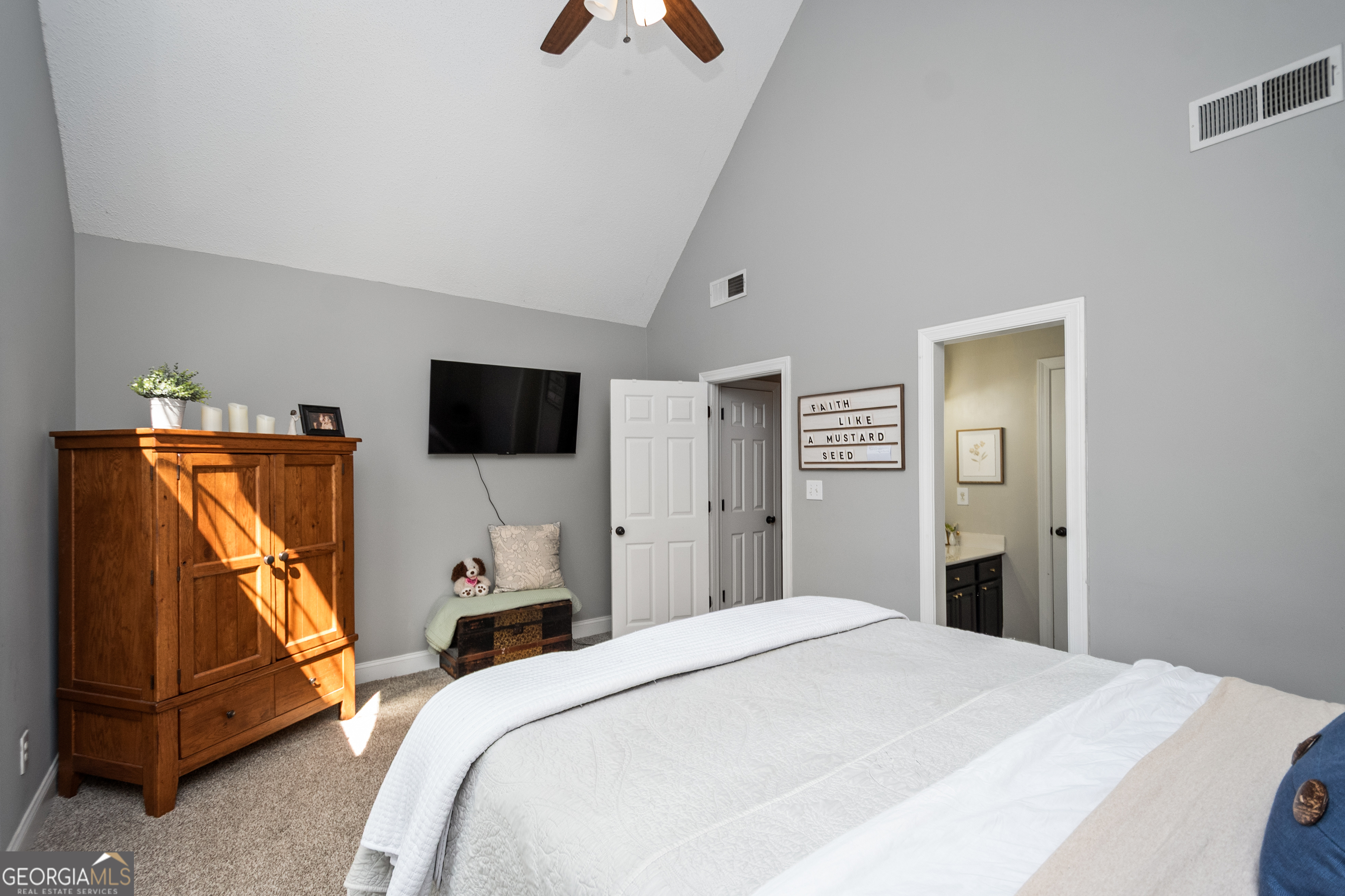 568 Martin Mill Road Moreland, GA 30259 - Photo 29 of 70 a bedroom with a bed and a flat screen tv