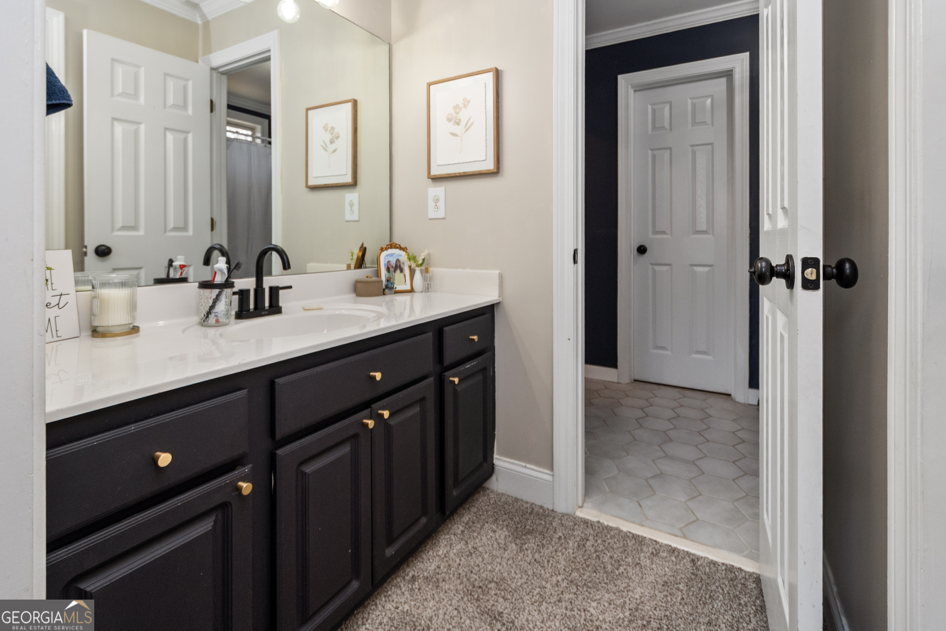 568 Martin Mill Road Moreland, GA 30259 - Photo 30 of 70 a bathroom with a double vanity sink and mirror