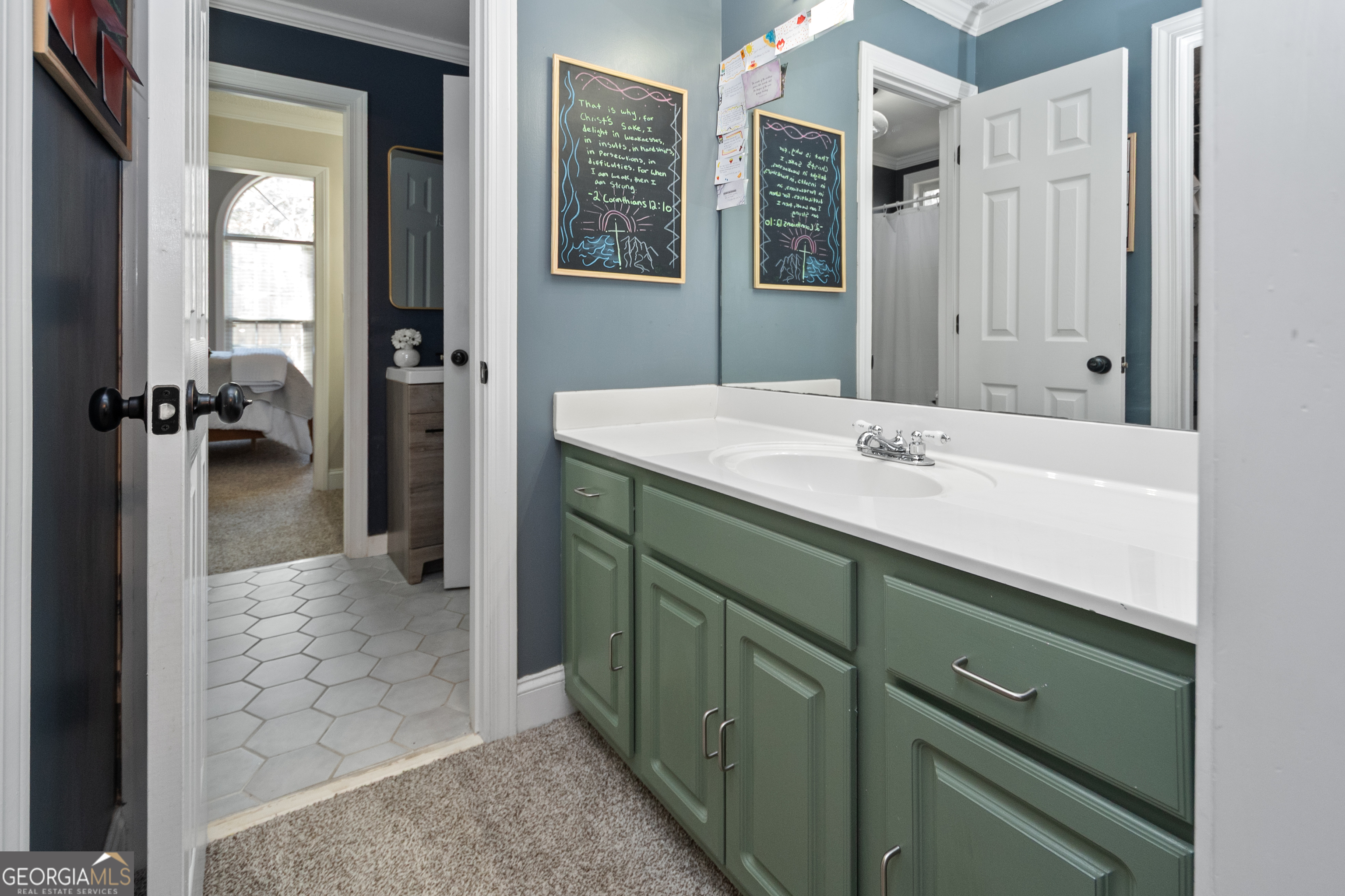 568 Martin Mill Road Moreland, GA 30259 - Photo 35 of 70 a bathroom with a sink and a mirror
