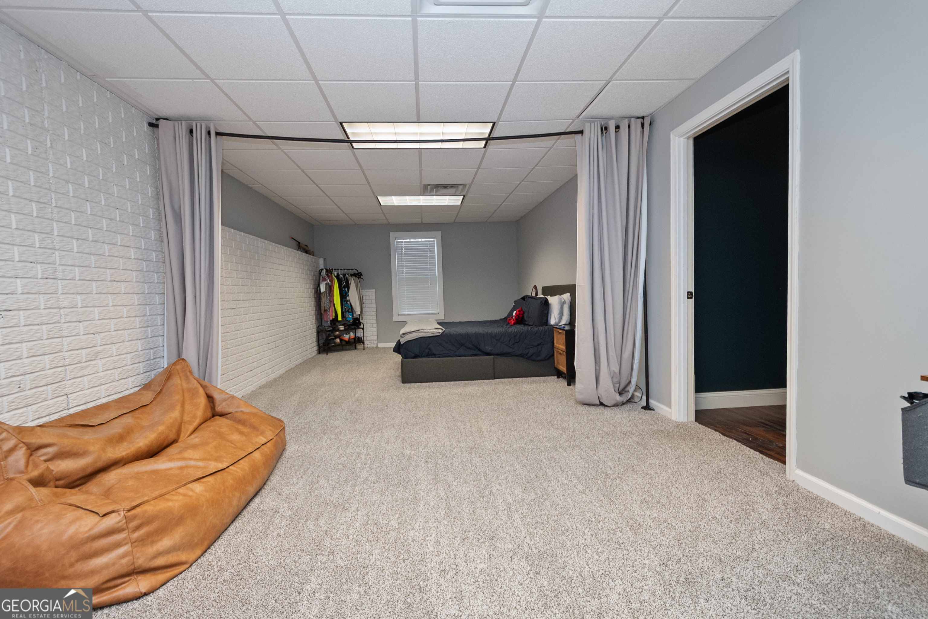 568 Martin Mill Road Moreland, GA 30259 - Photo 38 of 70 a bed room with a bed and a couch