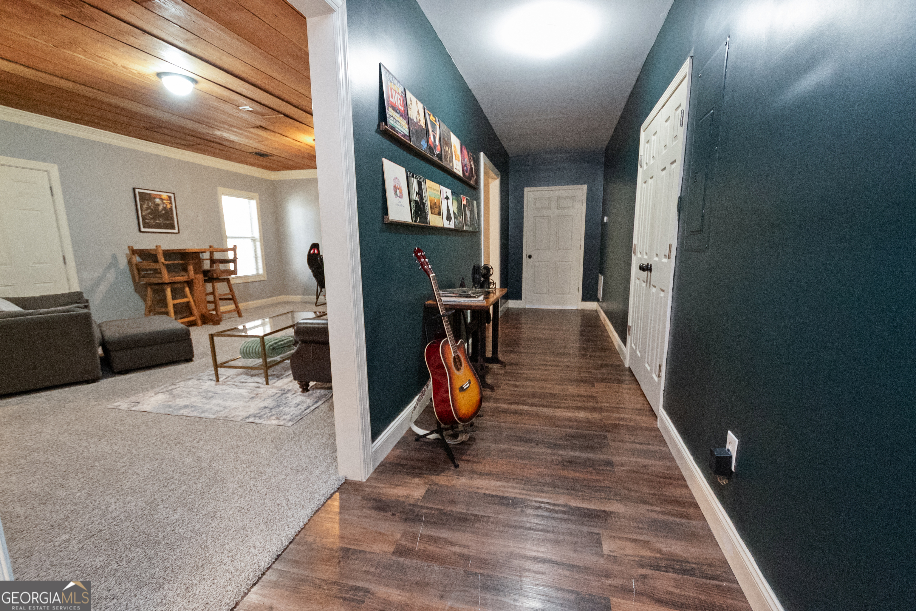 568 Martin Mill Road Moreland, GA 30259 - Photo 41 of 70 a view of a hallway with wooden floor and stairs