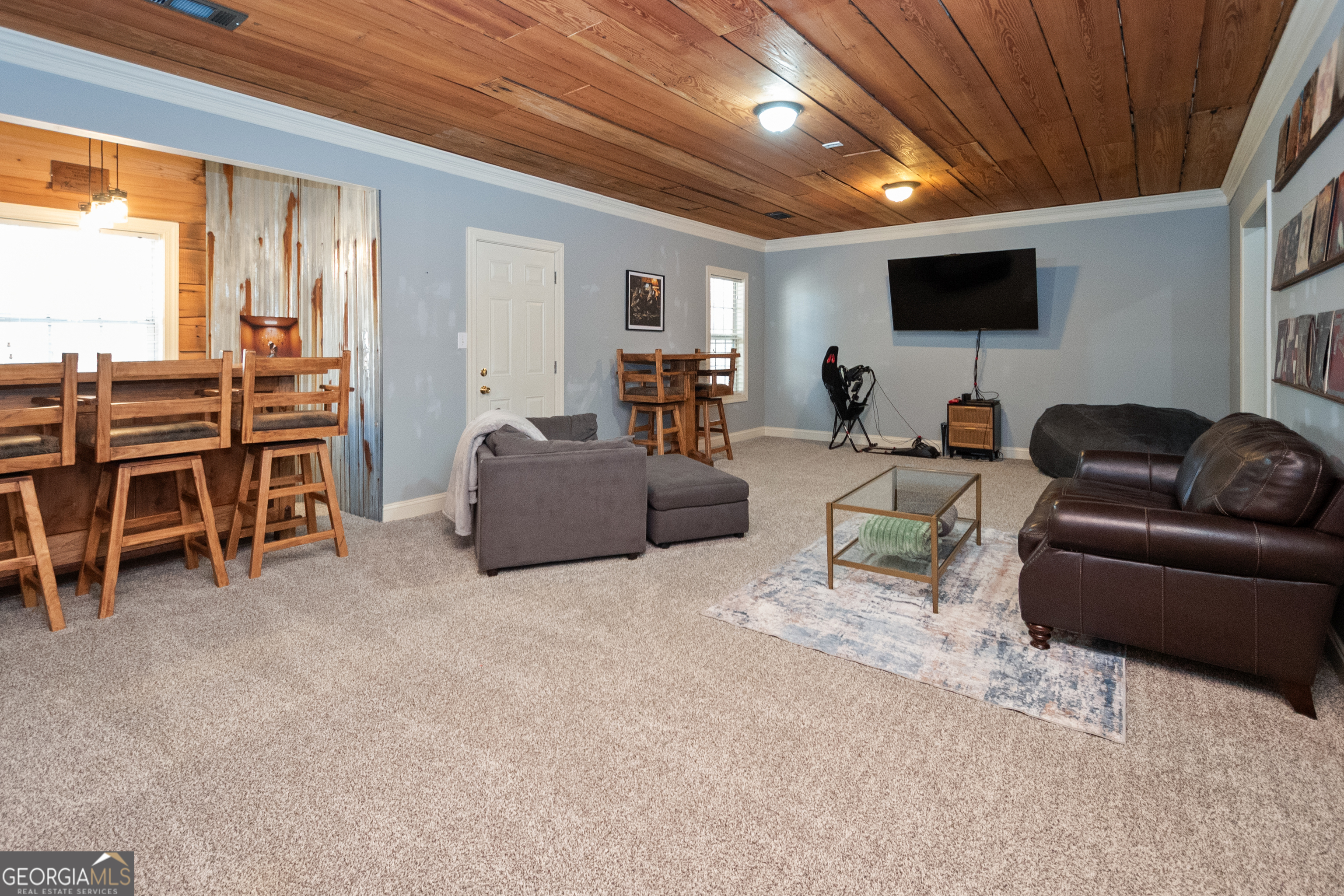 568 Martin Mill Road Moreland, GA 30259 - Photo 42 of 70 a living room with furniture and a flat screen tv