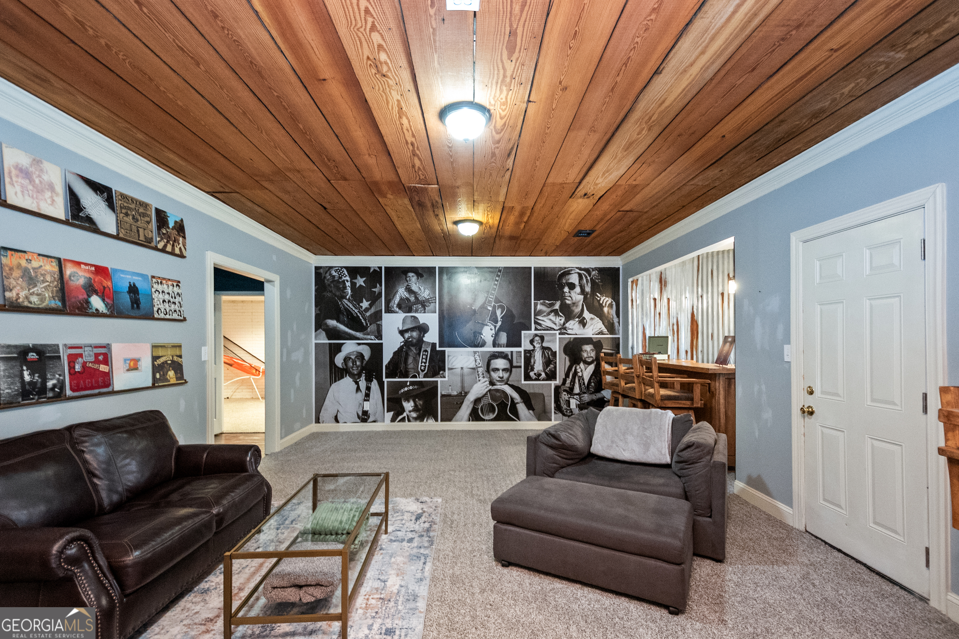 568 Martin Mill Road Moreland, GA 30259 - Photo 46 of 70 a living room with furniture and a chandelier