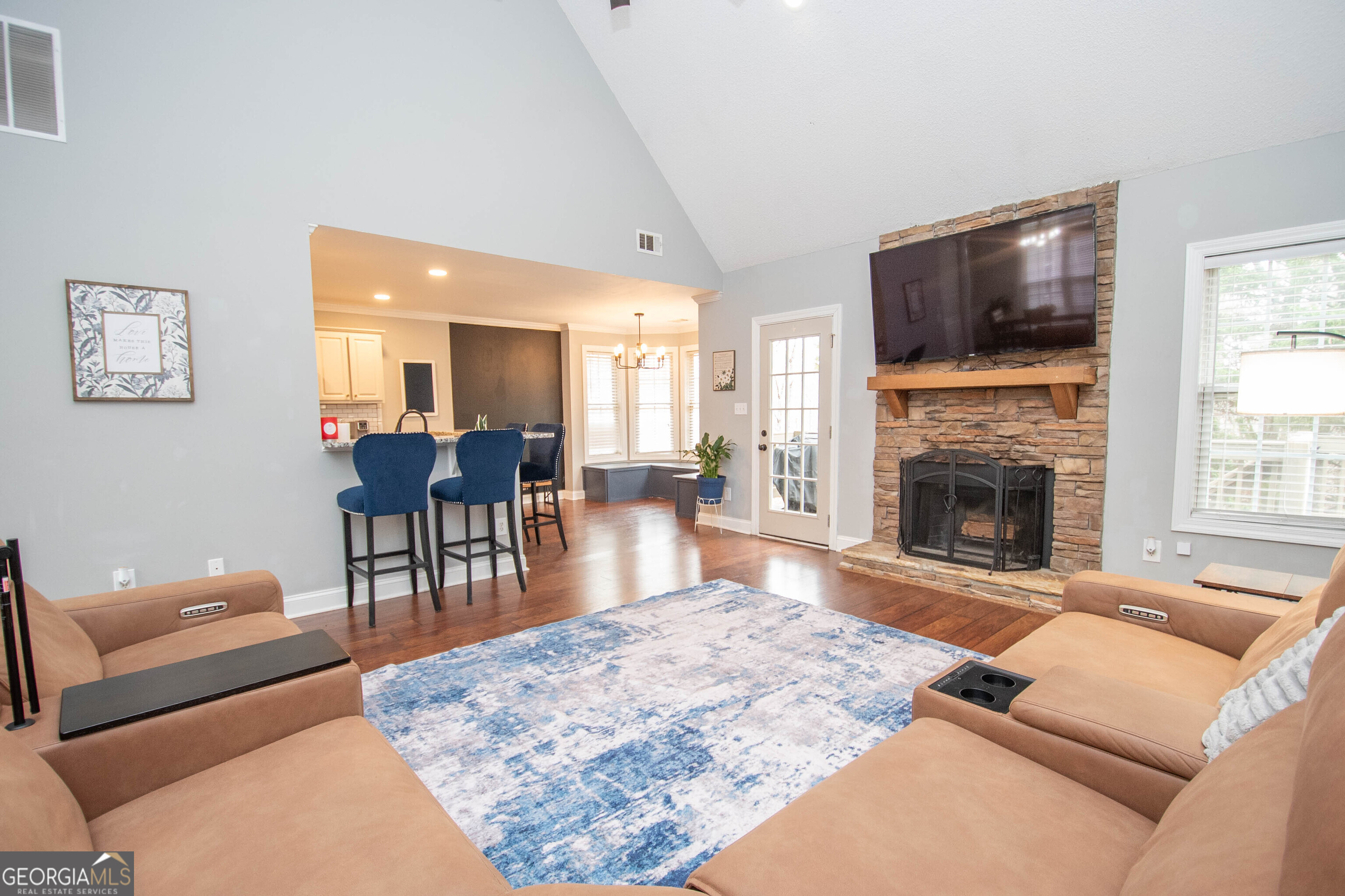 568 Martin Mill Road Moreland, GA 30259 - Photo 8 of 70 a living room with furniture a flat screen tv and a fireplace