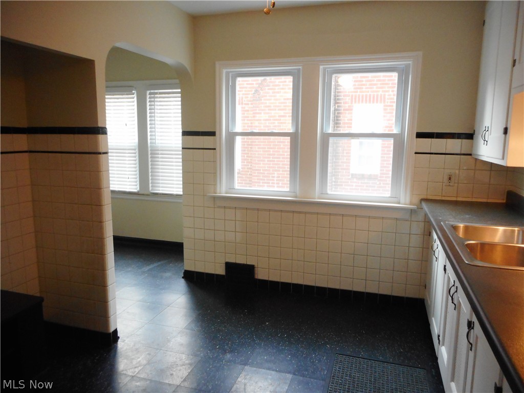 1150 Castleton Road Cleveland Heights, OH 44121 - Photo 4 of 25 Tucked away in this kitchen is an adorable eat-in nook with a built-in cabinet.