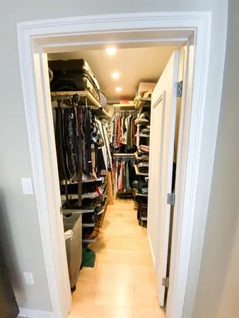 a view of a closet with storage