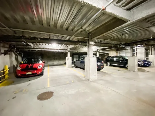 a view of parking garage with cars