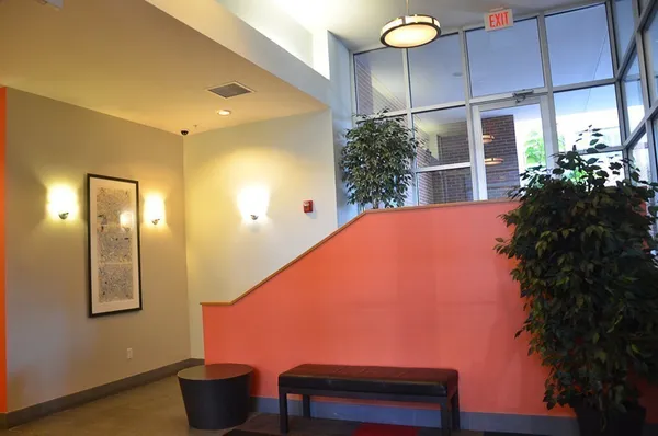 a view of a bathroom with a tub and shower