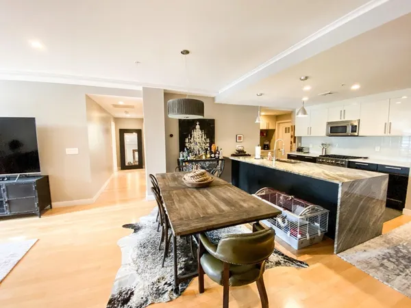 a kitchen with a table and chairs in it