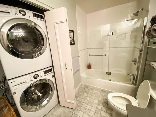 a bathroom with a sink and toilet with bathtub
