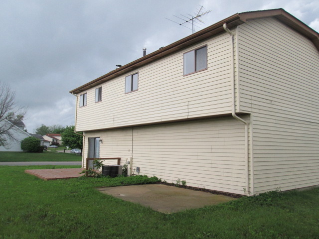 3055 Timber Hill Lane Aurora, IL 60504 - Photo 2 of 23 a view of a white house next to a yard