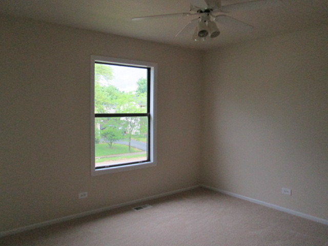 3055 Timber Hill Lane Aurora, IL 60504 - Photo 13 of 23 an empty room with a window