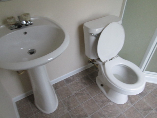 3055 Timber Hill Lane Aurora, IL 60504 - Photo 14 of 23 a white toilet sitting next to a white sink