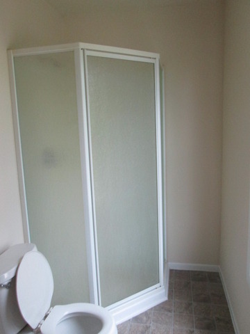 3055 Timber Hill Lane Aurora, IL 60504 - Photo 15 of 23 a bathroom with a toilet and a sink