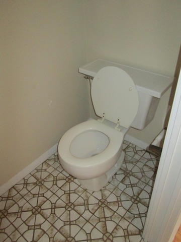 3055 Timber Hill Lane Aurora, IL 60504 - Photo 19 of 23 a bathroom with a toilet and a sink
