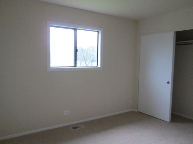 3055 Timber Hill Lane Aurora, IL 60504 - Photo 9 of 23 an empty room with a window