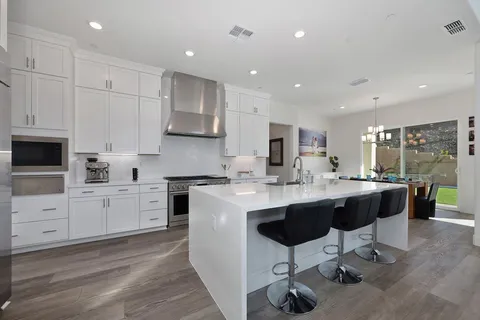 a view of living room with furniture and flat screen tv