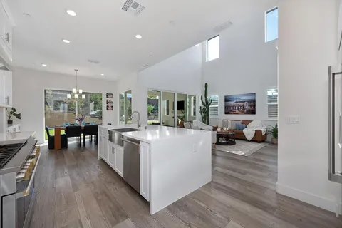 a spacious bedroom with a bed and a window