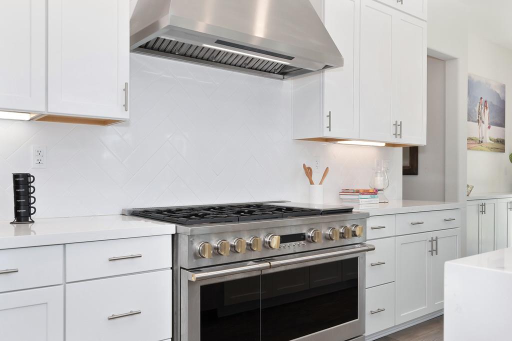 3063 Sherman Way El Dorado Hills, CA 95762 - Photo 21 of 75 a stove top oven sitting inside of a kitchen