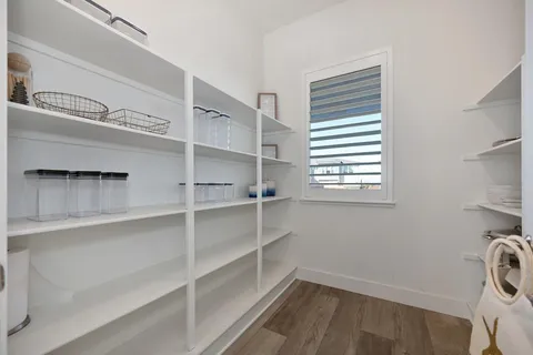 a view of entryway with stairs and wooden floor