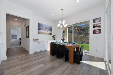 a bathroom with a double vanity sink toilet and a mirror