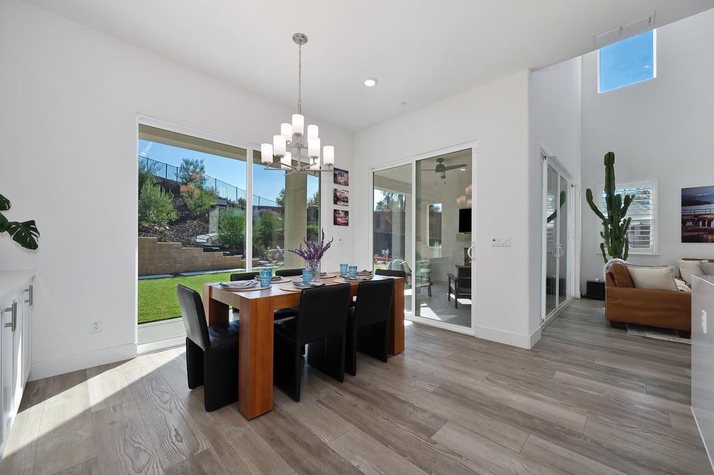 3063 Sherman Way El Dorado Hills, CA 95762 - Photo 25 of 75 a view of a dining room with furniture window and wooden floor