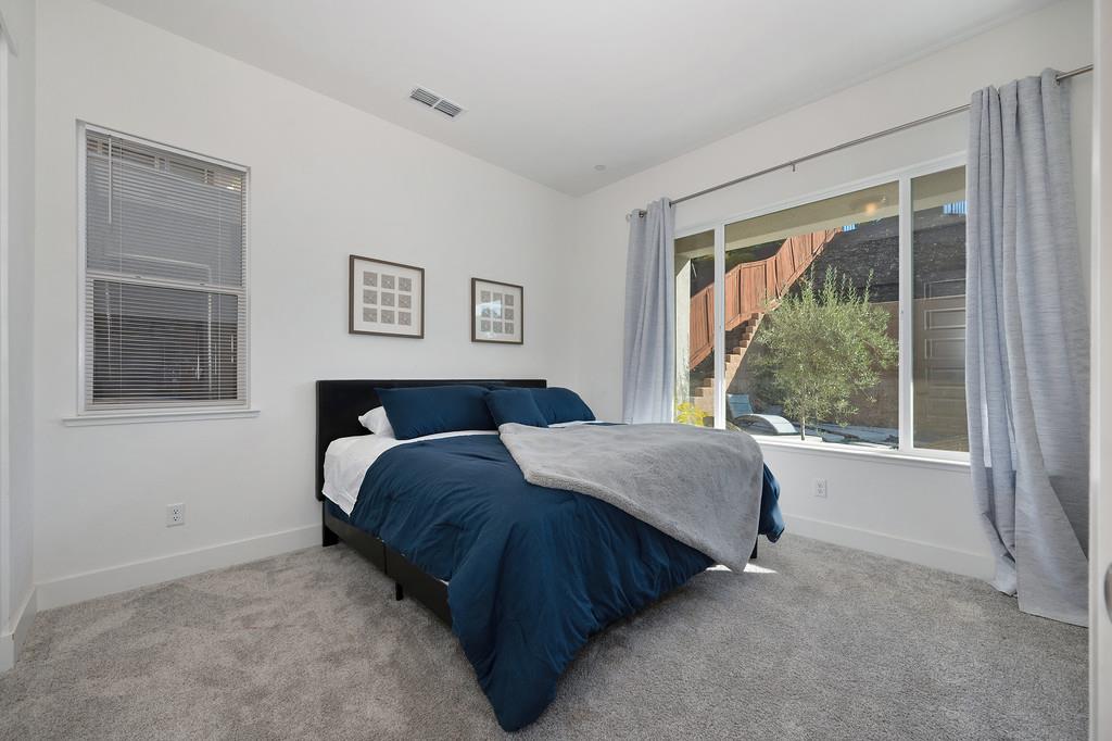 3063 Sherman Way El Dorado Hills, CA 95762 - Photo 27 of 75 a spacious bedroom with a bed and a window