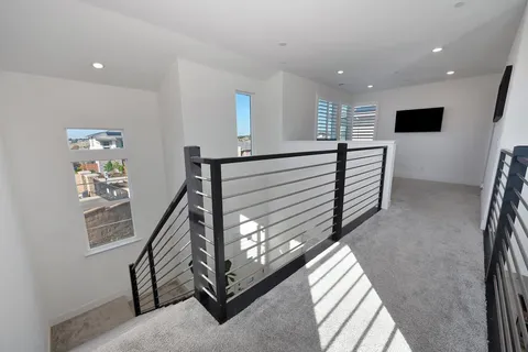 a bedroom with bed and a flat screen tv