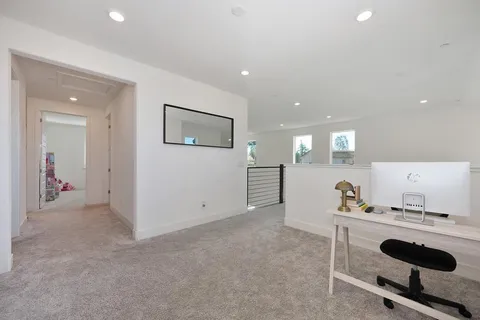 a en suite bathroom with a double vanity sink and a mirror