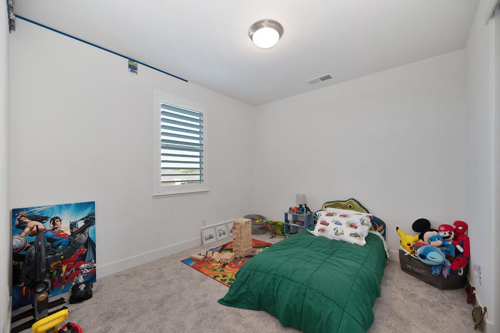 3063 Sherman Way El Dorado Hills, CA 95762 - Photo 33 of 75 a bedroom with bed and a window