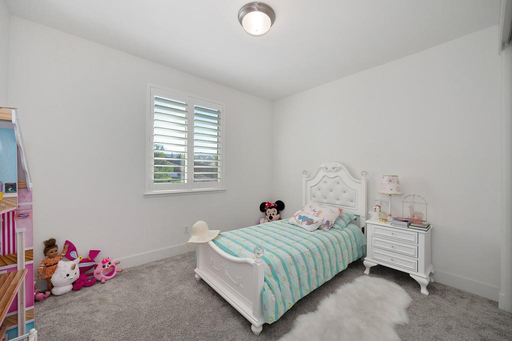 3063 Sherman Way El Dorado Hills, CA 95762 - Photo 35 of 75 a bedroom with a bed and a window