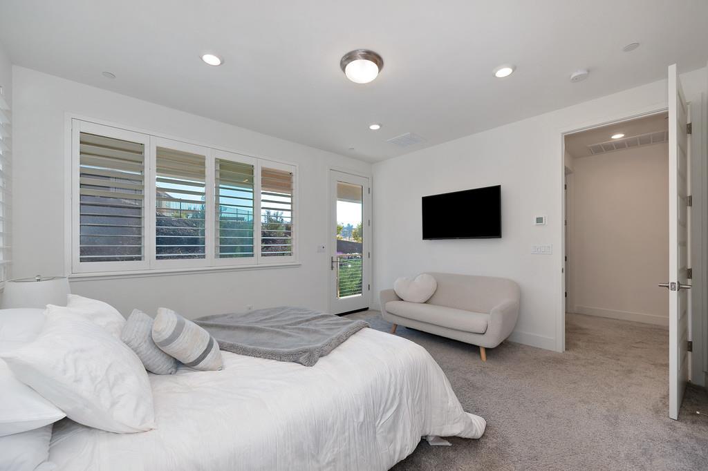 3063 Sherman Way El Dorado Hills, CA 95762 - Photo 40 of 75 a bedroom with bed and a flat screen tv
