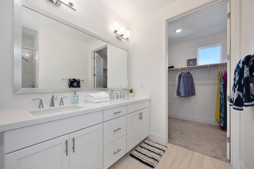 3063 Sherman Way El Dorado Hills, CA 95762 - Photo 42 of 75 a en suite bathroom with a double vanity sink and a mirror