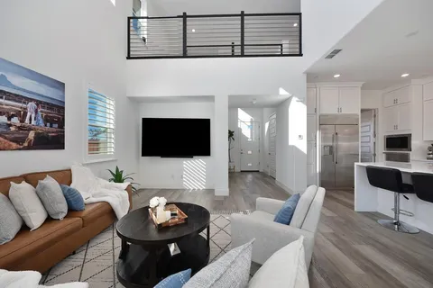 a kitchen with a sink stainless steel appliances and cabinets