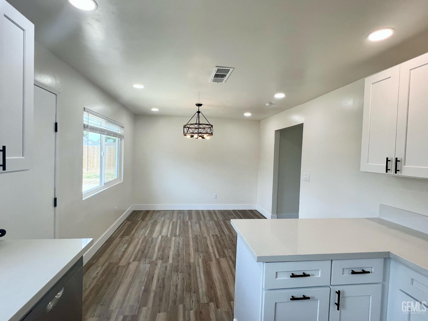Undisclosed Address Bakersfield, CA 93308 - Photo 11 of 23 a kitchen with kitchen island a counter top space a sink and appliances