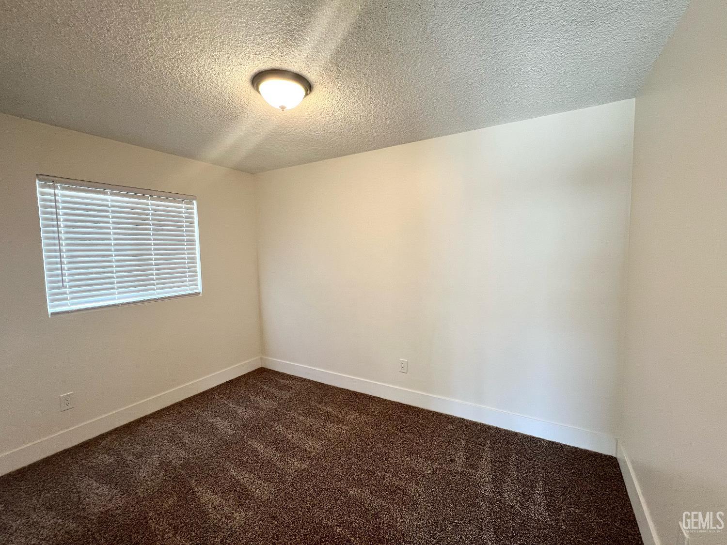 Undisclosed Address Bakersfield, CA 93308 - Photo 13 of 23 an empty room with a workbench