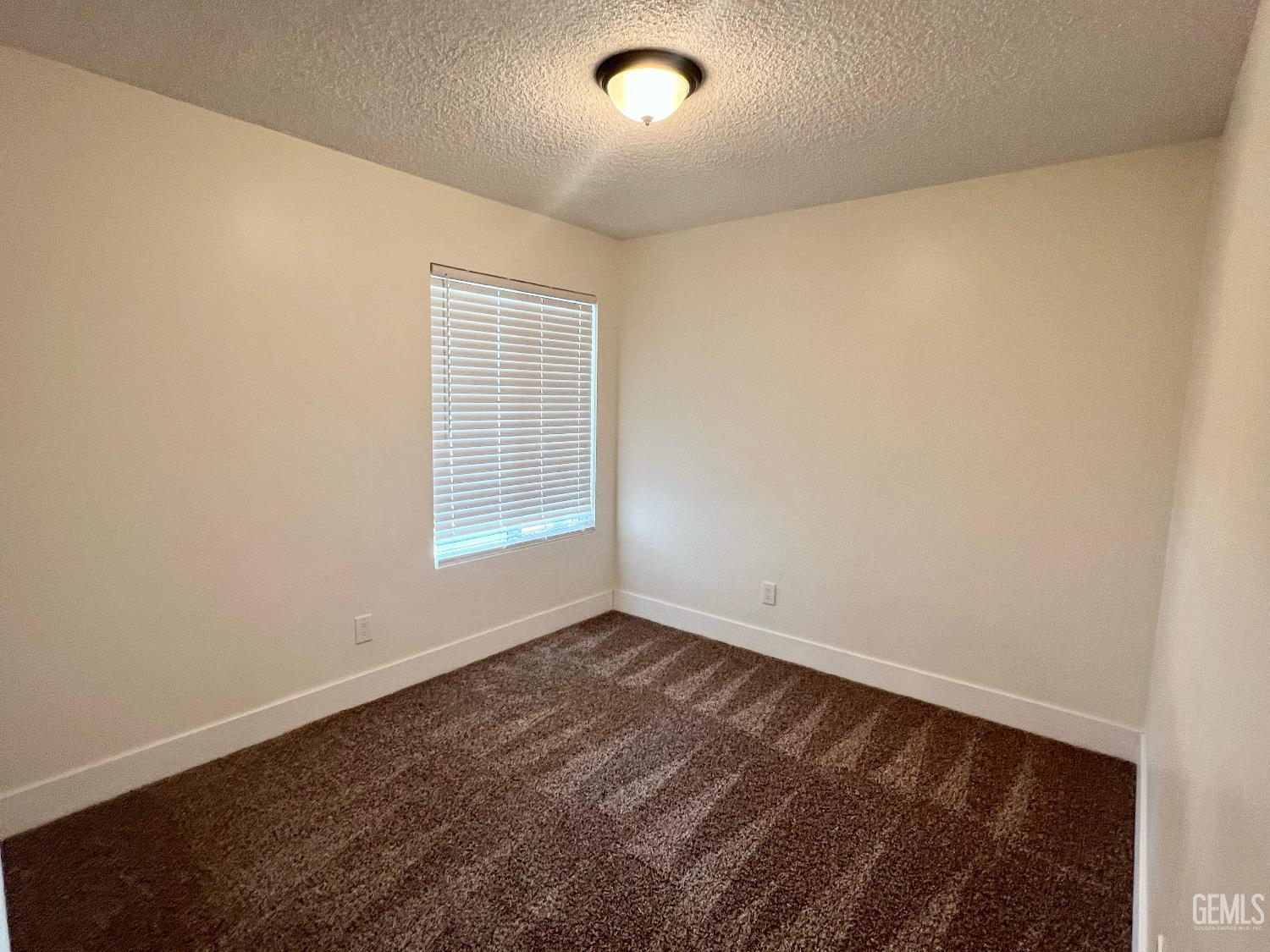 Undisclosed Address Bakersfield, CA 93308 - Photo 16 of 23 an empty room with a window