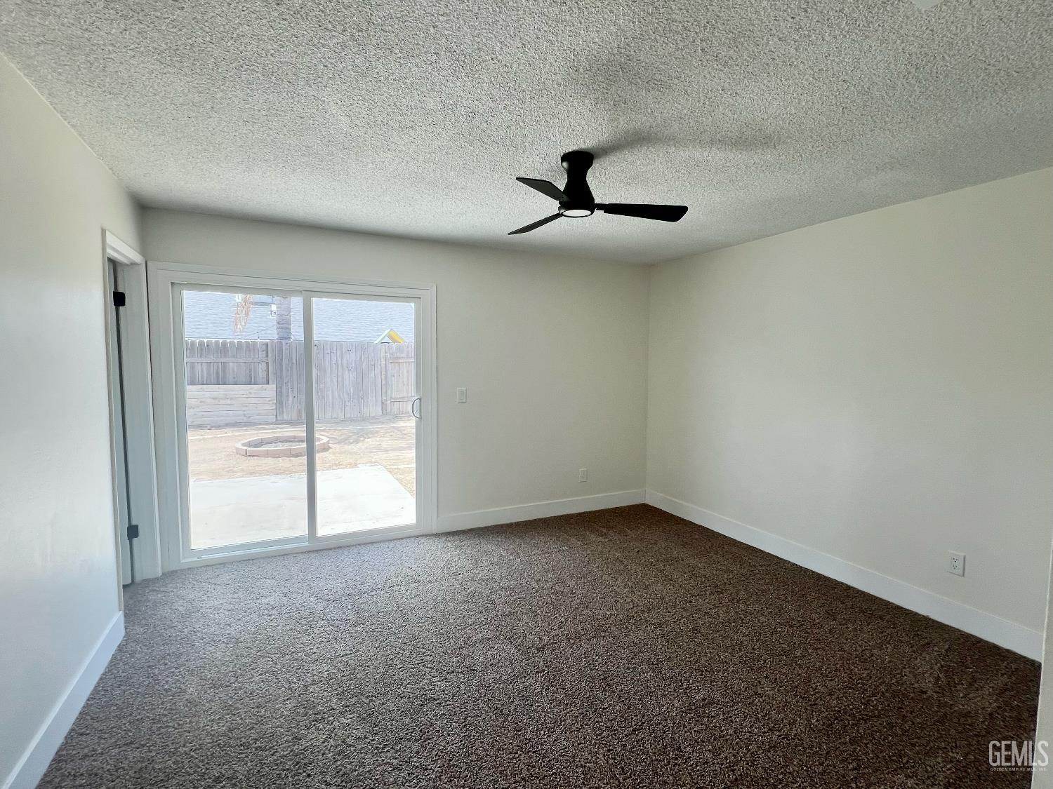 Undisclosed Address Bakersfield, CA 93308 - Photo 17 of 23 a view of an empty room with a window