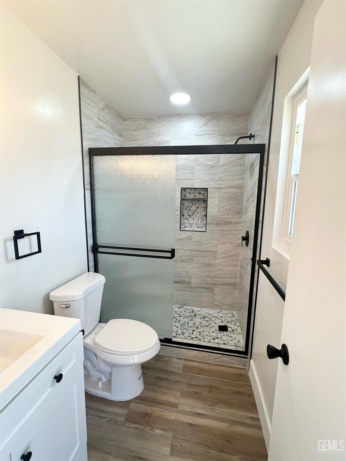 Undisclosed Address Bakersfield, CA 93308 - Photo 19 of 23 a bathroom with a toilet and a shower