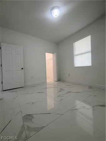 en empty room with windows