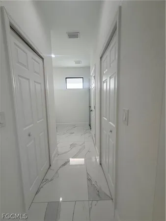 a view of a room with racks on the wall