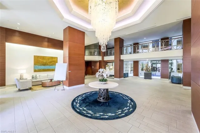 a view of a livingroom with furniture and a floor to ceiling window